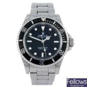 ROLEX - a gentleman’s stainless steel Oyster Perpetual Submariner bracelet watch.
