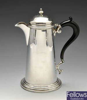 A mid-twentieth century silver hot water pot.
