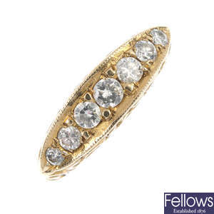 A 9ct gold diamond seven-stone ring.
