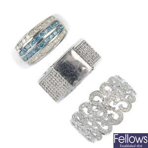 A selection of three 9ct gold diamond dress rings.