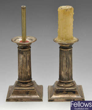 A pair of late Victorian Corinthian silver candlesticks. 