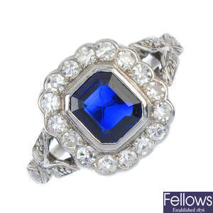 A mid 20th century 18ct gold synthetic sapphire and diamond cluster ring. 