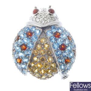A diamond and gem-set ladybird novelty pendant. 
