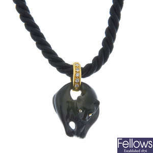 An onyx and diamond panther pendant. 