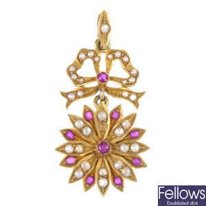 An early 20th century 15ct gold ruby and split pearl floral pendant. 