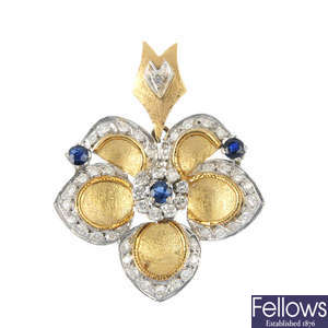 A sapphire and diamond floral pendant. 