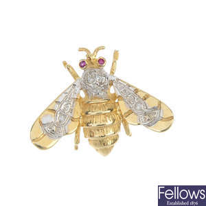A diamond and gem-set bee brooch.