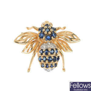 A sapphire and diamond bee brooch.