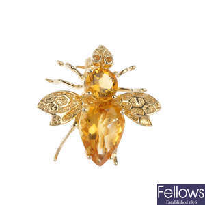 A citrine gem-set fly brooch.