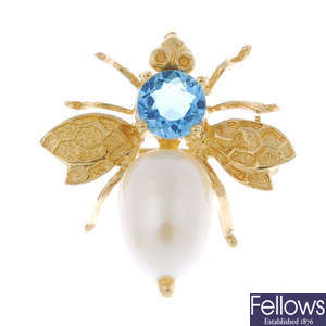A cultured pearl and topaz bee brooch.