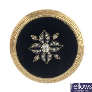 A late 19th century gold diamond and onyx brooch.
