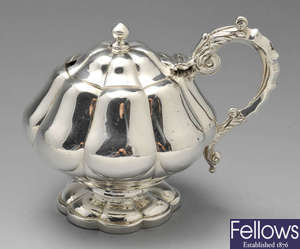 An early 19th century silver mustard pot.