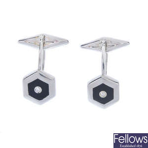 A pair of white metal diamond and enamel cufflinks.