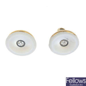A pair of early 20th century gold, mother-of-pearl and diamond buttons.