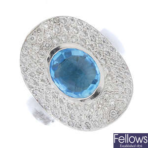 A topaz and diamond dress ring.