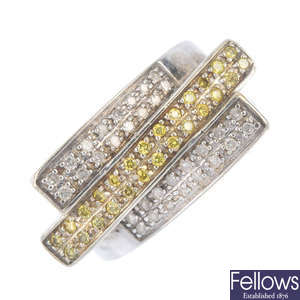 A colour treated 'yellow' diamond and diamond dress ring. 