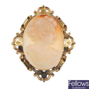 A gold shell cameo brooch and a pair of gold ear studs.
