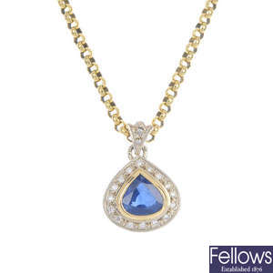 A sapphire and diamond cluster pendant.