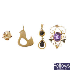A 14ct gold Pandora gem-set charm and three pendants. 