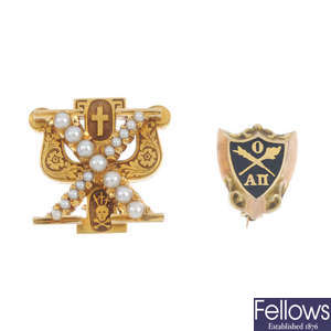 A selection of four sorority pins.