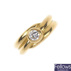 An 18ct gold diamond single-stone band ring.