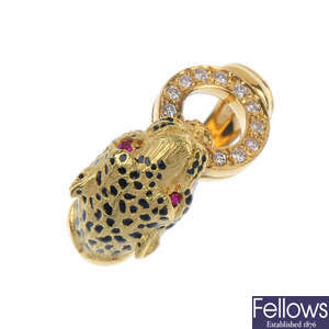 An 18ct gold diamond, ruby and enamel panther ring. 