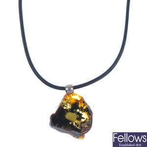 Three amber necklaces and four heart-shape amber pendants.