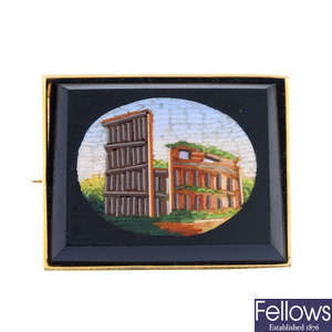 A micro mosaic brooch depicting the Coliseum in Rome.