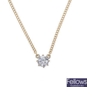 A 9ct gold diamond single-stone pendant.