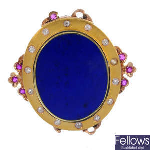 A lapis lazuli, diamond and ruby brooch.