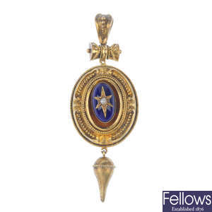A late Victorian gold plated and enamel pendant.
