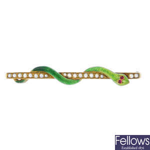 An early 20th century 15ct gold enamel and gem-set snake brooch.