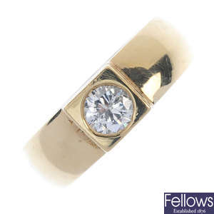 A gentleman's diamond single-stone band ring. 