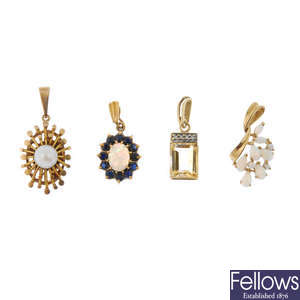 A selection of twelve gem-set pendants and a pair of ear studs.