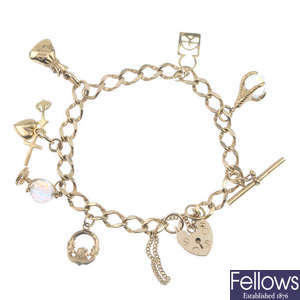 A 9ct gold bracelet, suspending seven charms.