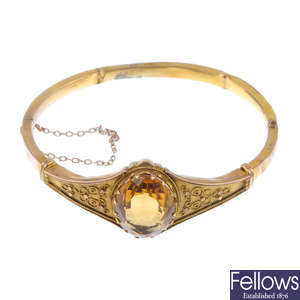 A late 19th century 9ct gold citrine hinged bangle.