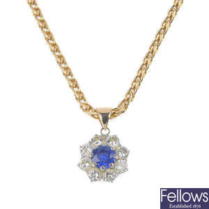 A sapphire and diamond cluster pendant. 