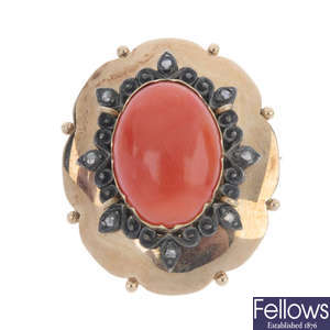An early 20th century gold coral and diamond brooch.