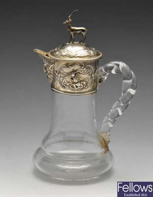 A Victorian silver mounted glass claret jug.