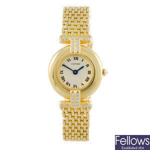 CARTIER - a diamond set yellow metal Rivoli bracelet watch.