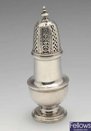 A George II silver caster of vase form with pierced cover and baluster finial. 