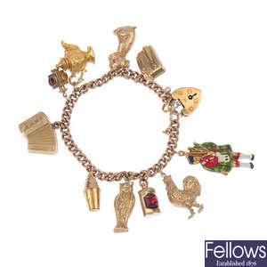 An early 20th century 9ct gold charm bracelet. 