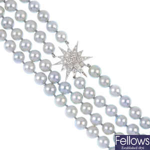 A cultured pearl two-row necklace with 18ct gold diamond clasp.