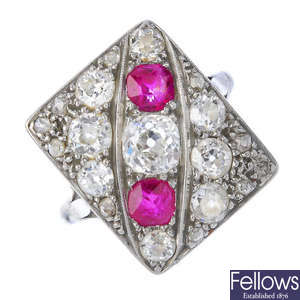 A mid 20th century platinum and 18ct gold diamond and ruby dress ring. 