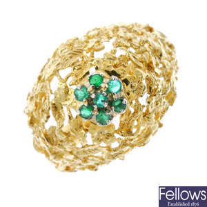 An emerald dress ring. 