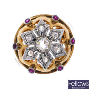 A diamond and synthetic ruby floral dress ring. 