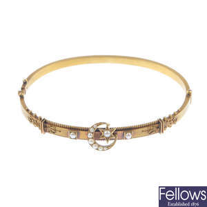 An early 20th century gold and split pearl bangle.