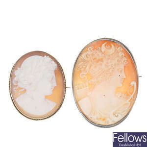 Two cameo brooches and a Wedgwood brooch.
