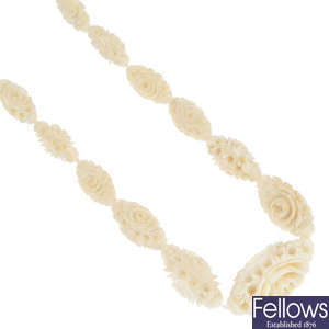 An early 20th century carved ivory bead necklace.