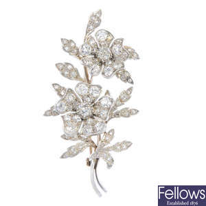 A floral diamond spray brooch.